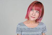 Studio shot of young beautiful Asian woman with pink hair against white background [IBR124309031]