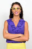 Studio shot of young beautiful businesswoman with curly hair against white background [IBR124309034]