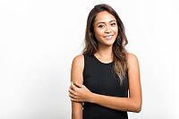 Studio shot of young beautiful Asian woman with brown hair against white background [IBR124309037]