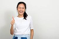 Studio shot of young beautiful Asian teenage girl against white background [IBR124309049]