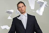 Studio shot of handsome bearded businessman with long hair against white background [IBR124309051]