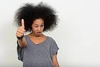 Studio shot of young beautiful African woman with Afro hair against white background [IBR124309066]