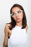 Studio shot of young beautiful Asian woman against white background [IBR124309069]
