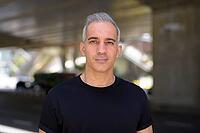 Portrait of handsome Persian man with gray hair in the city streets outdoors [IBR124309077]
