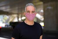 Portrait of Persian man with mask for protection from corona virus outbreak and pollution in the city streets outdoors [IBR124309078]