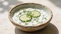 A herb dip with cucumber slices and dill in a bowl in natural light, delicious dip, perfect as a side dish for meals and parties, AI generates, AI generated [IBR124458832]