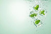 Ice cubes with mint leaves sink in sparkling water on green background, healthy food, AI generated [IBR124458837]