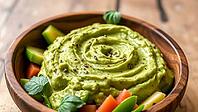 Creamy avocado dip in a wooden bowl surrounded by mixed vegetables, delicious dip, perfect as a side dish for meals and parties, AI generates, AI generated [IBR124458848]