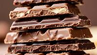 Stacked layers of dark chocolate with smooth surface and rich texture, delicious chocolate, beautifully presented, AI generated [IBR124458859]