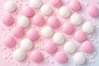Pink and white candies on a pastel background decorated with hearts, pastel candy, AI generated [IBR124458871]