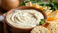Creamy cheese dip in a wooden bowl with crackers and fresh herbs, delicious dip, perfect as a side dish for meals and parties, AI generates, AI generated [IBR124458895]