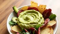Creamy avocado dip in a bowl served with various vegetable sticks, delicious dip, perfect as a side dish for meals and parties, AI generates, AI generated [IBR124458899]