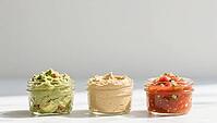Three glasses of guacamole, hummus and salsa on a white background, delicious dip, perfect as a side dish for meals and parties, AI generated [IBR124458904]
