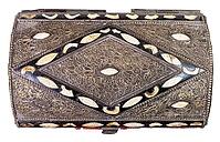 View from above of a traditional old Arab coffin decorated with incrustations against a white background [IBR124458919]