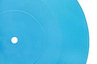 Close-up blue transparent flexible phonograph against white background [IBR124458921]