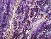 Macro shot of a natural mineral stone background made of tumbled charoite gemstone [IBR124458922]