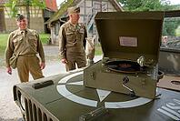 Living History Event at the Hohenloher Open Air Museum, Hohenlohe, Wackershofen, US Army, US Military Police, Military Police, Police, Farmermuseum, Record player, Record Record, Country Life, Rural, Swabian-Franconian Forest nature park Park, Schwäbisch  [IBR124469131]