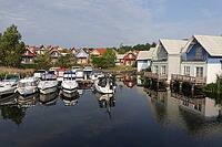 Charter boats and holiday homes in Marina Wolfsbruch, Rheinsberg, Brandenburg, Germany [IBR124494810]