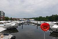 Charter boats and holiday homes in Marina Wolfsbruch, Rheinsberg, Brandenburg, Germany [IBR124494819]