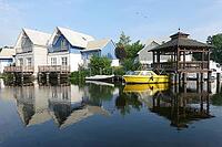 Charter boats and holiday homes in Marina Wolfsbruch, Rheinsberg, Brandenburg, Germany [IBR124494832]