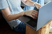 Working from home concept. Woman jands typing on laptop keyboard. Remote work from home workplace [IBR124497447]
