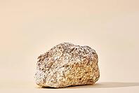 Natural granit stone on beige background, minimal product podium [IBR124497460]