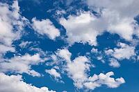 White cumulus clouds in blue sky, beautiful cloudscape background [IBR124497462]