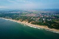 Aerial view of sea landscape with sand beach in Wladyslawowo. Baltic sea coastline in Poland. Resort town in summer season [IBR124497485]