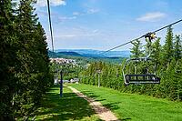 Beautiful mountains, covered with forest and open cable car line. Karpacz resort in Poland with lift road. Family outdoor recreation in mountains [IBR124497486]