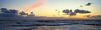 Sea coastline with waves. Baltic sea against dramatic cloudy sky at sunset. Panoramic nature landscape [IBR124497512]