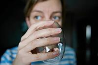 Woman drinks water, Close-up shot of woman drinking fresh clean water from glass, Quenching thirst, Lifestyle healthcare concept [IBR124497513]