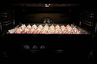 Process of making homemade meringue, Cooking sweet cream for dessert on baking sheet in oven [IBR124497514]