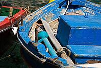 Fishing kaykis in Armeni the port of Oia, Cyclades, Oia, Santorini, Greece [IBR124525355]