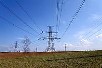 Electricity pylons conducting current from distribution power station, blackout and grid stability concept, copy space [IBR124525358]
