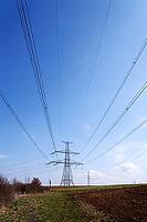 Electricity pylons conducting current from distribution power station, blackout and grid stability concept, copy space [IBR124525416]