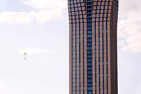 Paraglider with the tallest building in Scandinavia Karlatornet skycraper in Lindholmen, Gothenburg, Sweden, sunny day [IBR124525450]