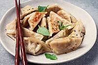 Japanese fried dumplings, gyoza, sesame seeds, top view, no people [IBR124552200]