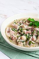 Muzhuzhi, a Georgian dish made from pork legs, with spices and herbs, homemade [IBR124552213]