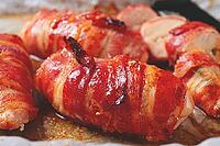 Baked chicken breast, wrapped in bacon, on a baking tray. in the home kitchen.close-up [IBR124552226]