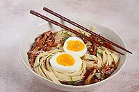 Buckwheat noodles soba with shimeji mushrooms, with boiled egg, green onion, sesame seeds, homemade, without people [IBR124552243]