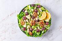 Fresh Waldorf salad, celery stalk with chicken, apple and walnuts, grapes, herbs, homemade, without people [IBR124552246]