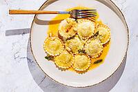 Italian dish, ravioli with butter and sage top view, no people [IBR124552252]