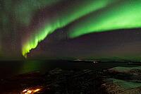 Northern Lights (Aurora borealis) over the Norwegian Sea, S$00F6r$00F6ya, Finnmark, Norway, December 2018 [IBR124563527]