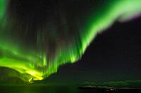 Northern Lights (Aurora borealis) over the Norwegian Sea, S$00F6r$00F6ya, Finnmark, Norway, December 2018 [IBR124563538]