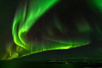 Northern Lights (Aurora borealis) over the Norwegian Sea, S$00F6r$00F6ya, Finnmark, Norway, December 2018 [IBR124563539]