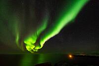 Northern Lights (Aurora borealis) over the Norwegian Sea, S$00F6r$00F6ya, Finnmark, Norway, December 2018 [IBR124563553]