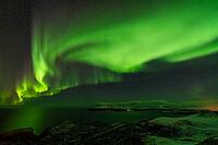 Northern Lights (Aurora borealis) over the Norwegian Sea, S$00F6r$00F6ya, Finnmark, Norway, December 2018 [IBR124563554]