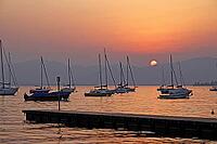 On the Bardolino waterfront, Lake Garda in the evening, Italy - At the promenade of Bardolino, Lake Garda in Italy in the evening [IBR124585239]