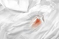Glass, with pink wine, spilled on a white shirt, close-up, selective focus, no people, concept, top view [IBR124585343]