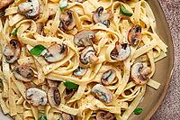 Fettuccine with champignons, basil, in cream sauce, homemade, no people [IBR124585351]